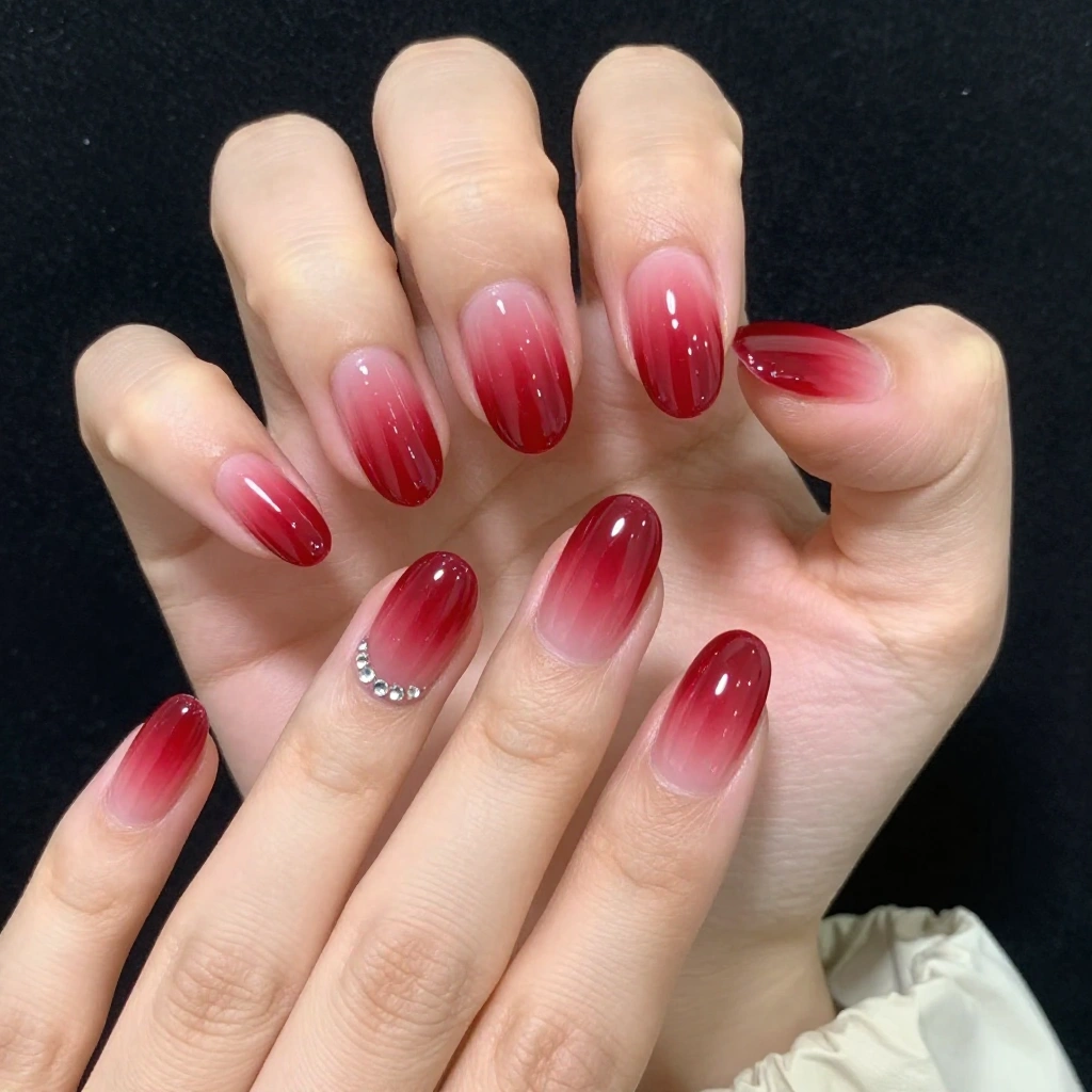 Red Ombre Oval Nails with Rhinestone Accents
